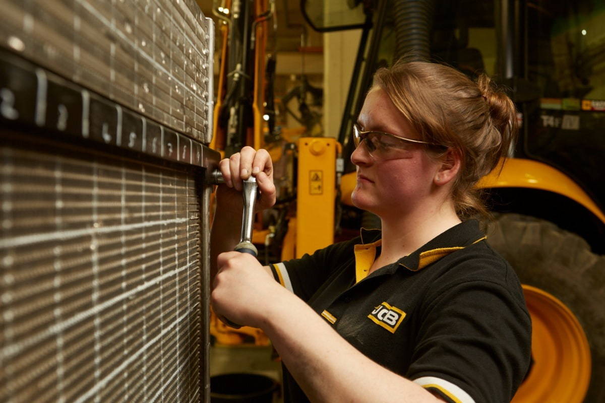Female worker at JCB on the production line