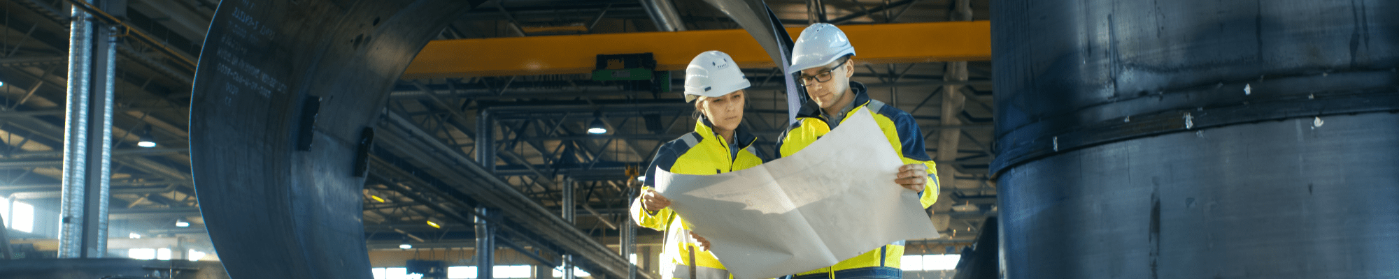 Man and woman in engineering warehouse