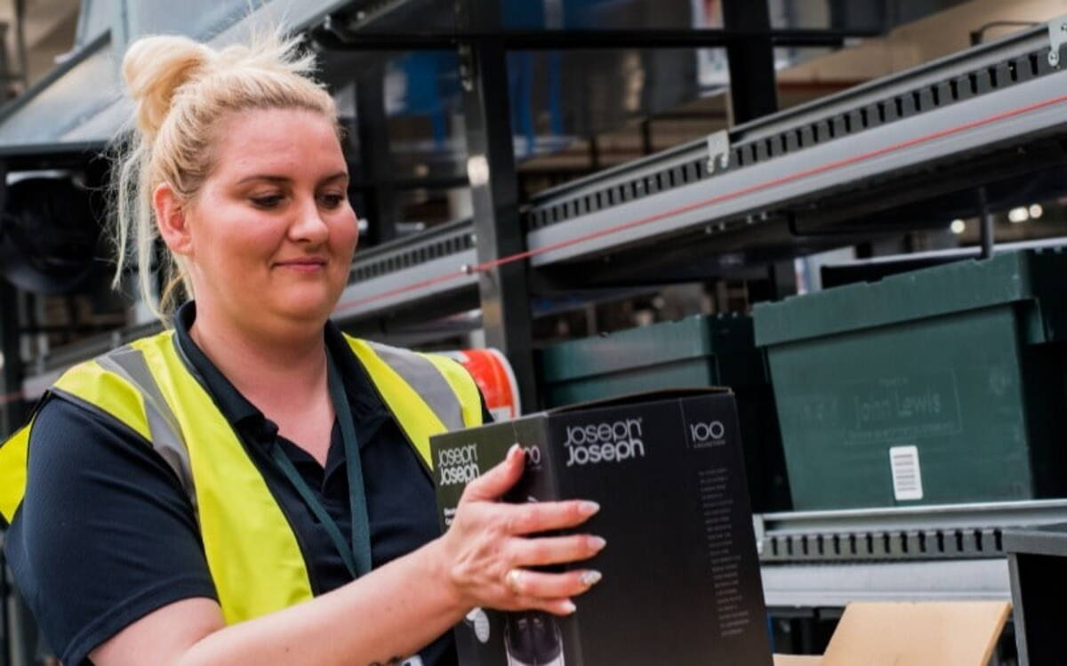 Female John Lewis employee smiling 