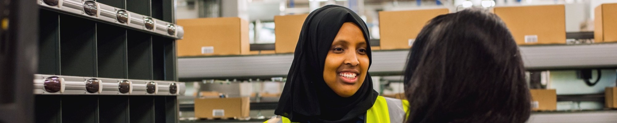 Female John Lewis worker smiling