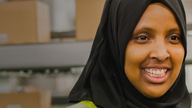 Female John Lewis worker smiling