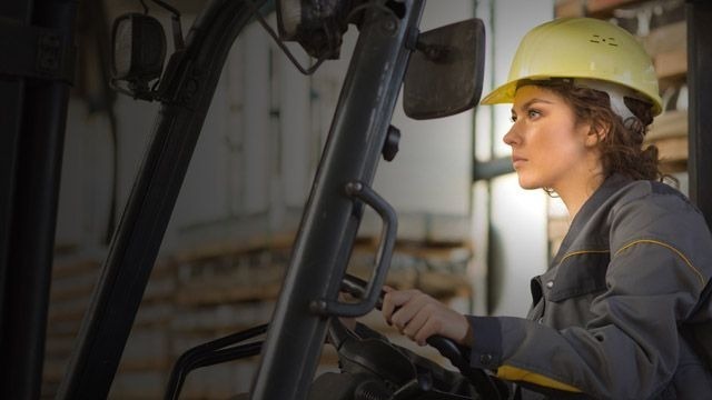 Female warehouse worker doing her job